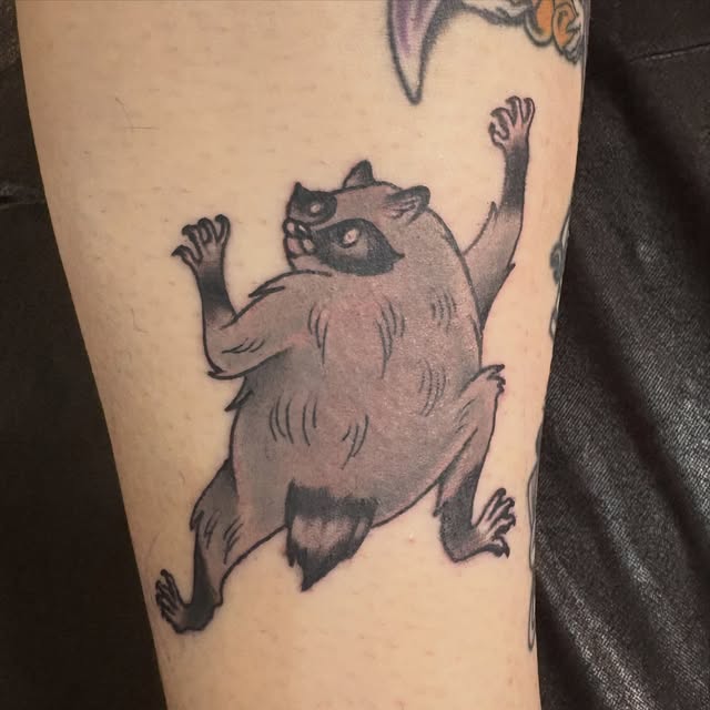Climbing raccoon tattoo from the Tattoo Tattoo Seattle grid